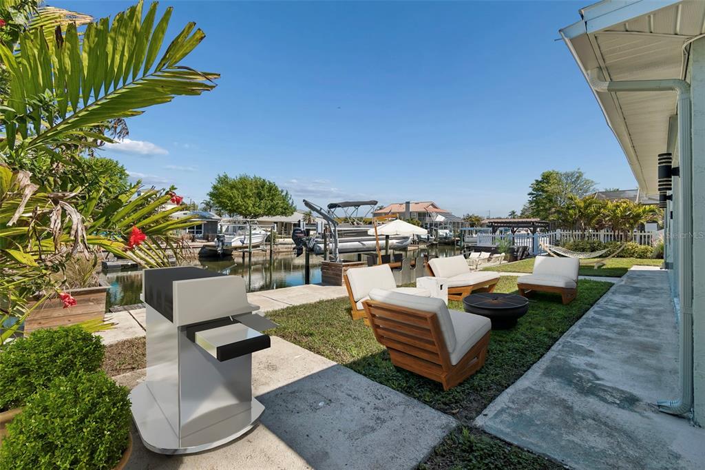 4417 Rudder Way New Port Richey, FL 34652 - Photo 15 of 47 an outdoor sitting area with couch and outdoor view