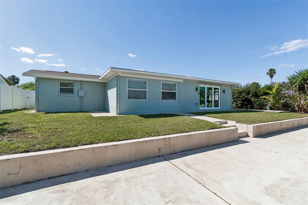4417 Rudder Way New Port Richey, FL 34652 - Photo 16 of 47 a view of house with a yard