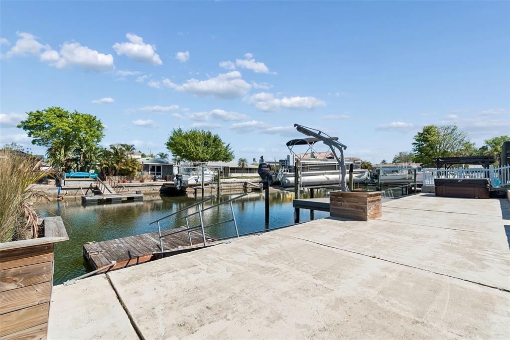 4417 Rudder Way New Port Richey, FL 34652 - Photo 20 of 47 a view of a swimming pool with an outdoor seating