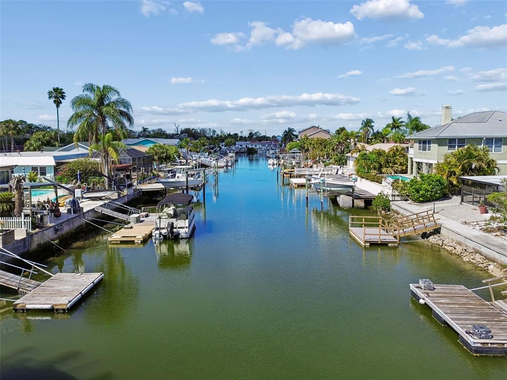 4417 Rudder Way New Port Richey, FL 34652 - Photo 31 of 47 a view of a lake with boats and trees