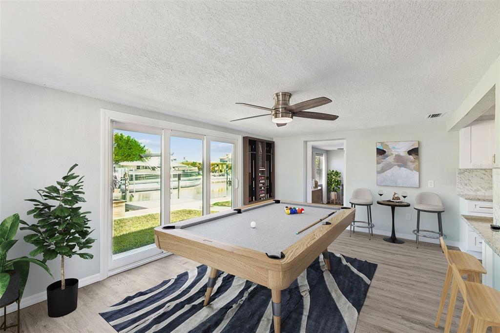4417 Rudder Way New Port Richey, FL 34652 - Photo 5 of 47 a view of a dining room with furniture window and wooden floor