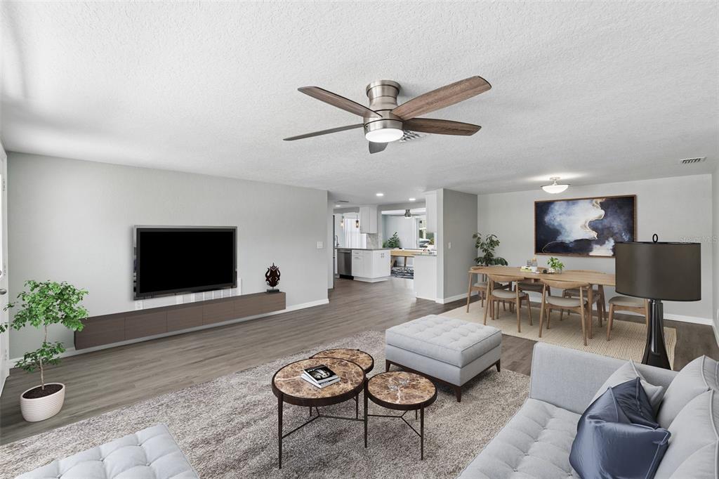 4417 Rudder Way New Port Richey, FL 34652 - Photo 6 of 47 a living room with furniture and a flat screen tv