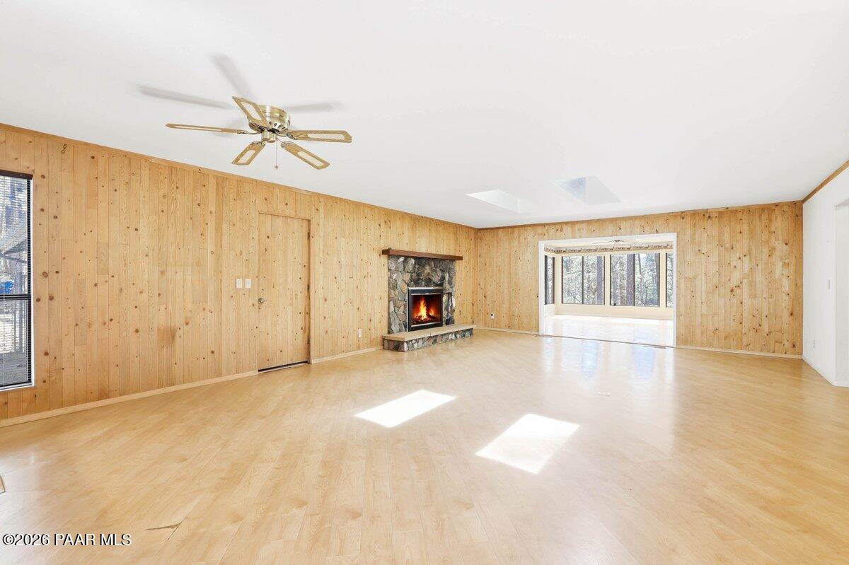 748 East Marapai Road Prescott, AZ 86303 - Photo 13 of 47 a view of empty room with wooden floor and fan