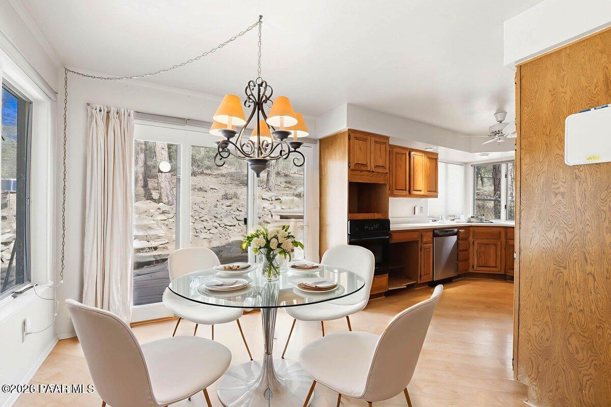 748 East Marapai Road Prescott, AZ 86303 - Photo 15 of 47 a view of a dining room with furniture and wooden floor