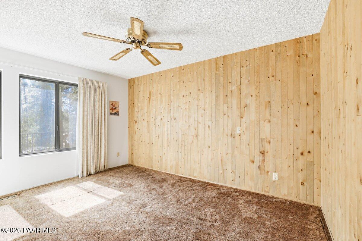 748 East Marapai Road Prescott, AZ 86303 - Photo 18 of 47 a view of a big room with chandelier fan and windows