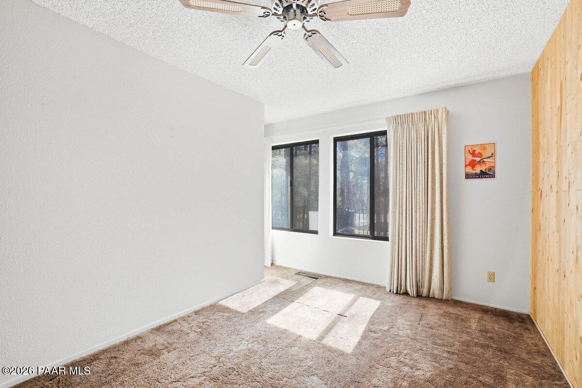 748 East Marapai Road Prescott, AZ 86303 - Photo 19 of 47 an empty room with fan and windows
