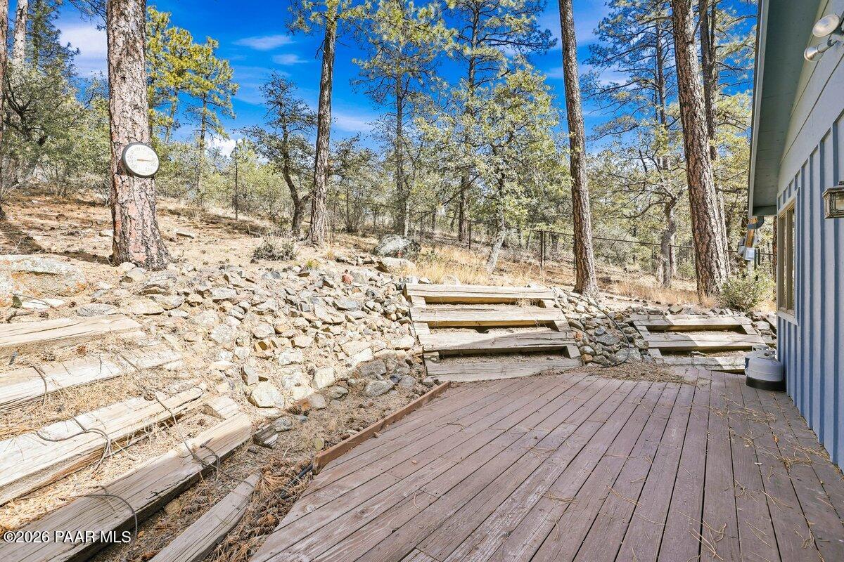 748 East Marapai Road Prescott, AZ 86303 - Photo 28 of 47 a view of a balcony with chairs and wooden floor