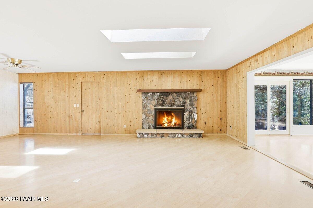 748 East Marapai Road Prescott, AZ 86303 - Photo 9 of 47 a view of an empty room with a fireplace