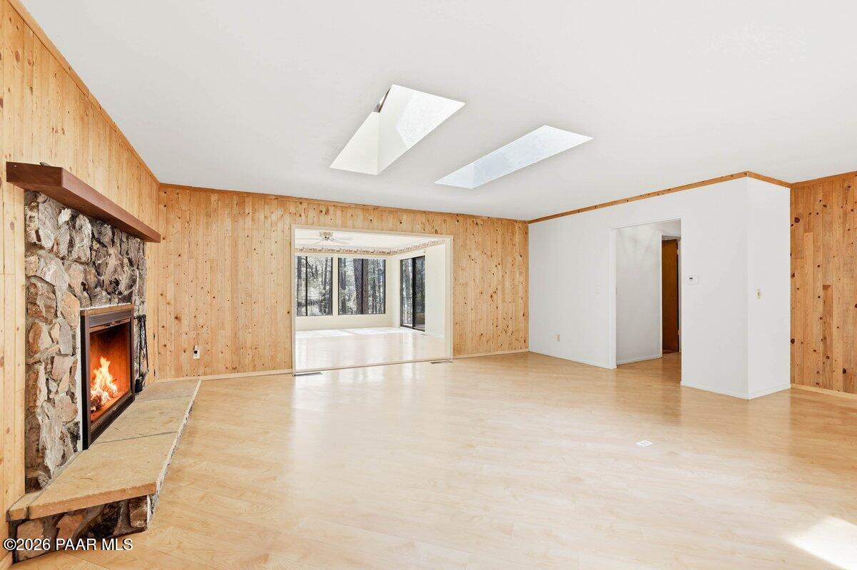 748 East Marapai Road Prescott, AZ 86303 - Photo 10 of 47 a view of an empty room with a fireplace