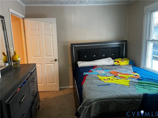 a bedroom with a bed and ceiling fan