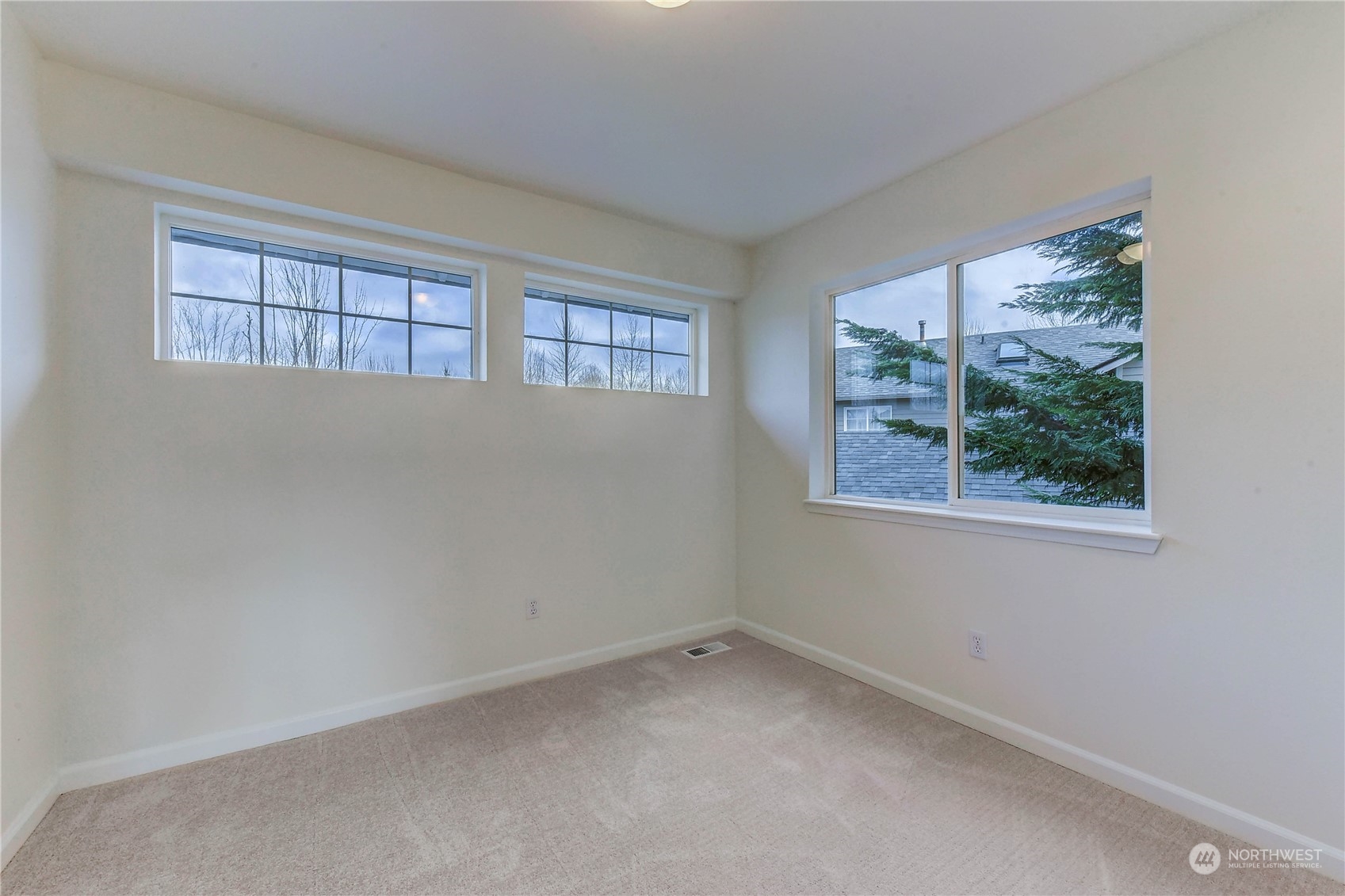 4407 Northeast 6th Place Renton, WA 98059 - Photo 23 of 25 an empty room with a window