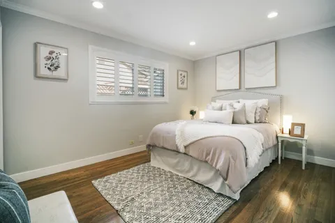a bedroom with a bed and a couch