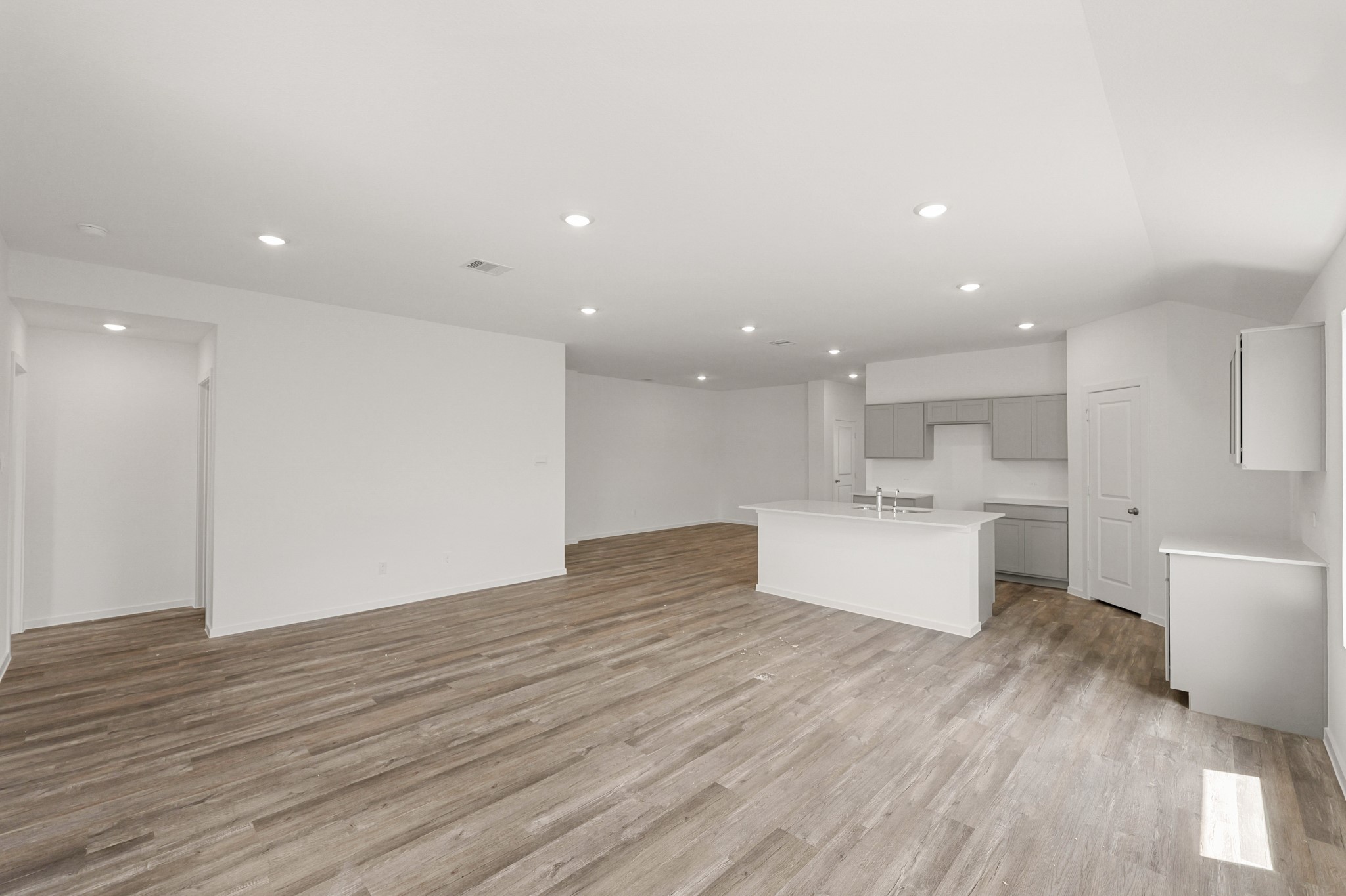 517 Wax Myrtle Way Hockley, TX 77447 - Photo 3 of 17 a view of kitchen with kitchen island wooden floors appliances and cabinets