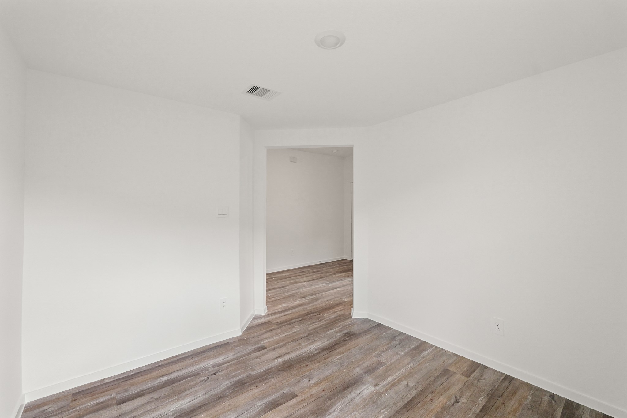 517 Wax Myrtle Way Hockley, TX 77447 - Photo 6 of 17 a view of an empty room with wooden floor