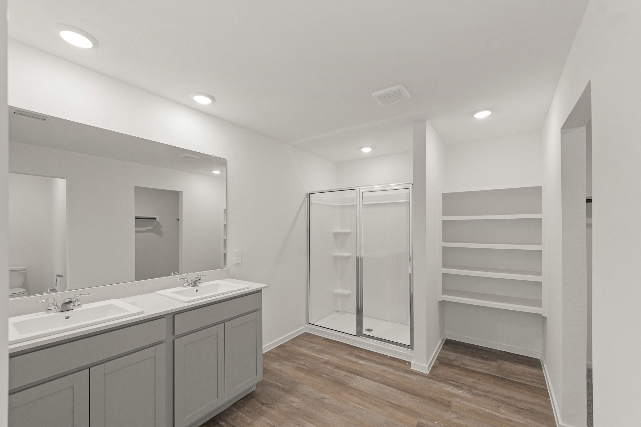 517 Wax Myrtle Way Hockley, TX 77447 - Photo 10 of 17 a bathroom with a double vanity sink and a mirror