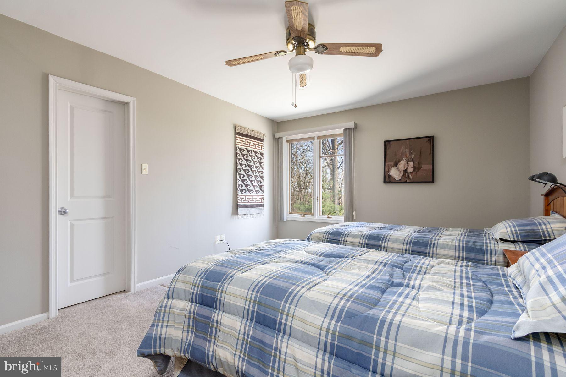 20 Solebury Mountain Road New Hope, PA 18938 - Photo 28 of 43 a bedroom with a large bed and a chandelier