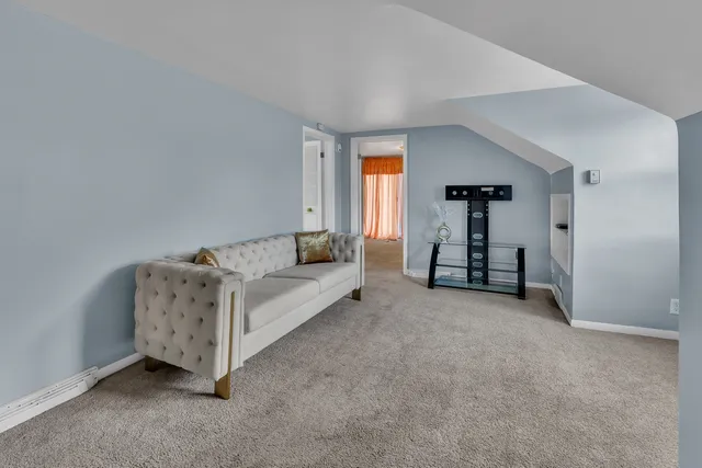 a living room with furniture and a table