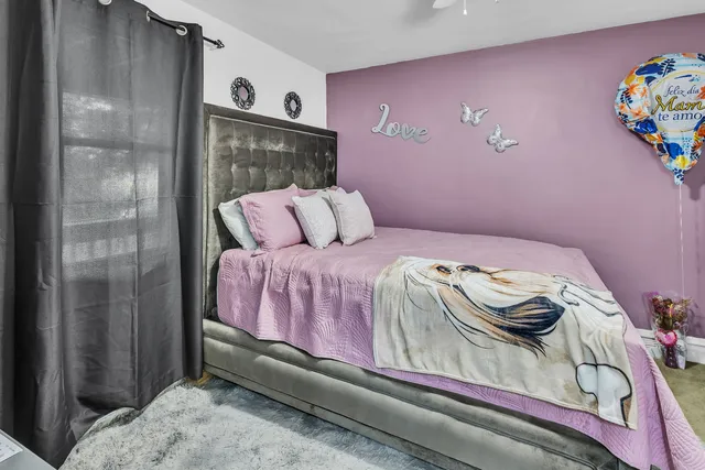 a bedroom with a bed and a table