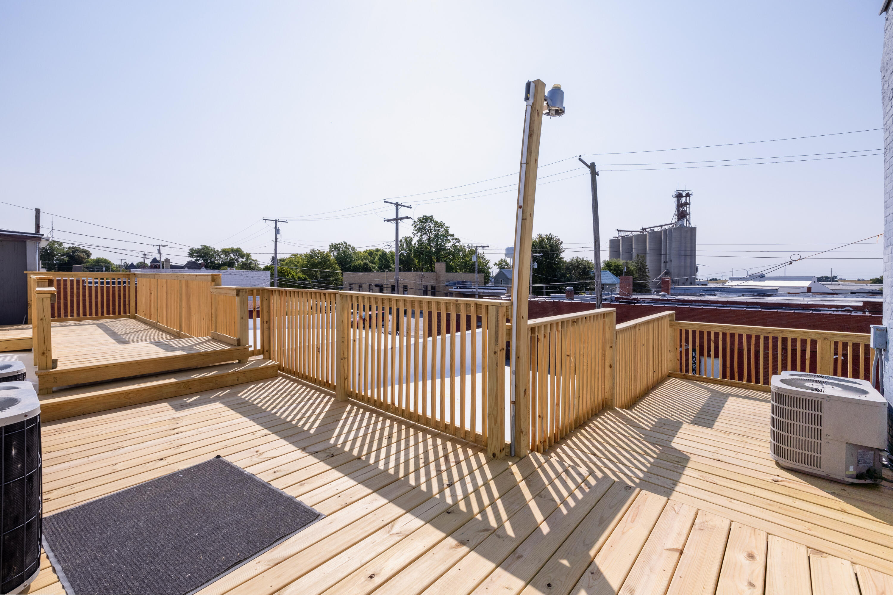 202 East 5th Street Fowler, IN 47944 - Photo 11 of 38 a view of balcony with wooden floor and outdoor seating