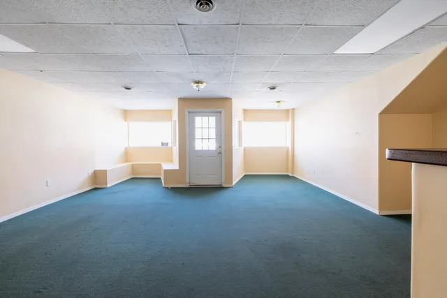 an empty room with a empty space and a window