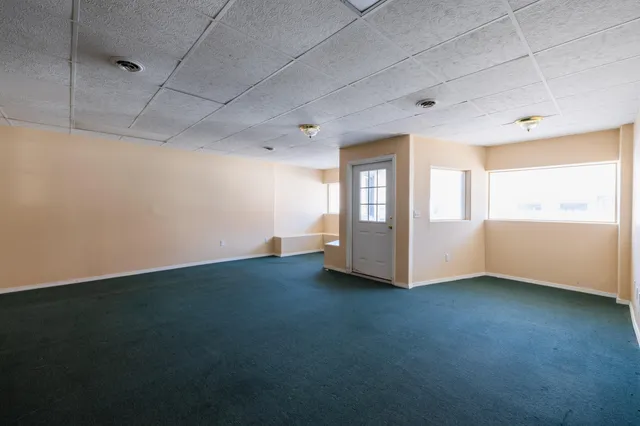 a view of empty room with windows