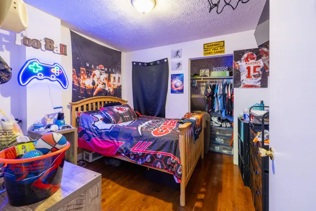 a living room with furniture a window and gym equipment