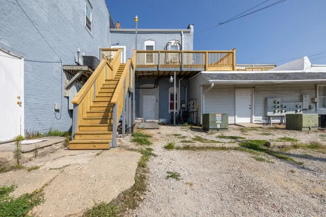 a view of a balcony with wooden floor