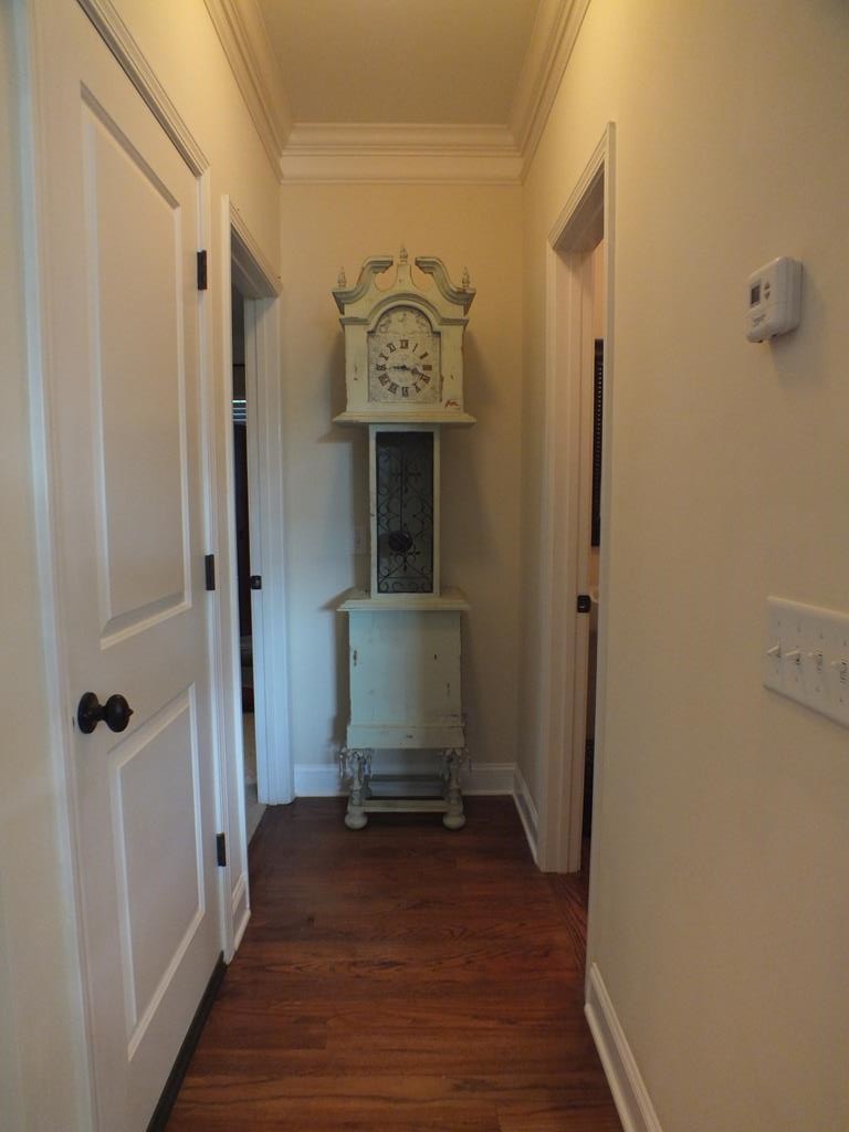 5641 Tucker Road Ooltewah, TN 37363 - Photo 13 of 53 a view of a hallway with wooden floor and a bathroom
