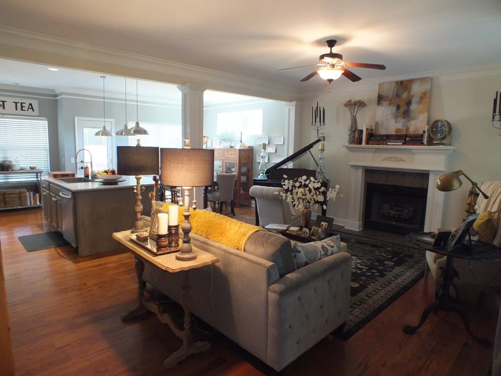 5641 Tucker Road Ooltewah, TN 37363 - Photo 16 of 53 a living room with furniture and a fireplace