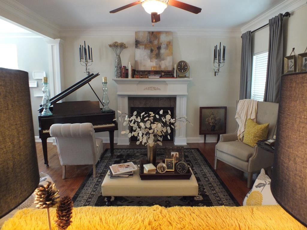 5641 Tucker Road Ooltewah, TN 37363 - Photo 17 of 53 a living room with furniture and a fireplace