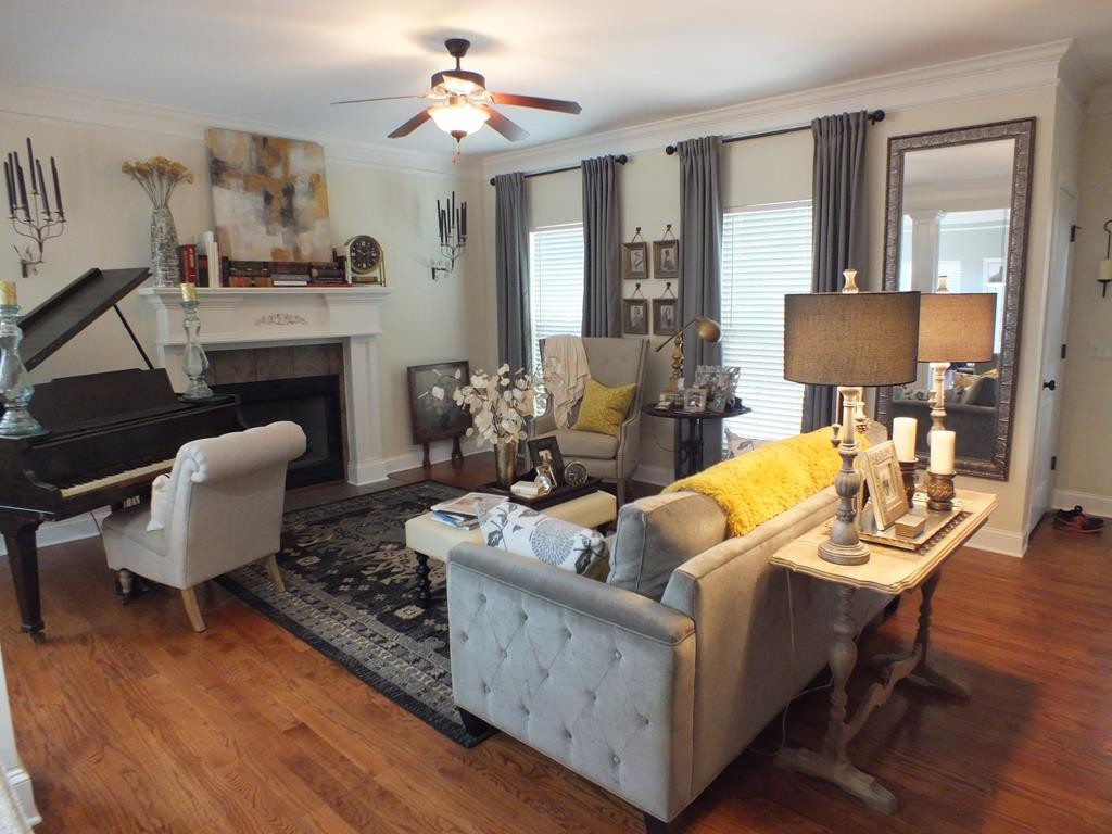 5641 Tucker Road Ooltewah, TN 37363 - Photo 18 of 53 a living room with furniture and a fireplace
