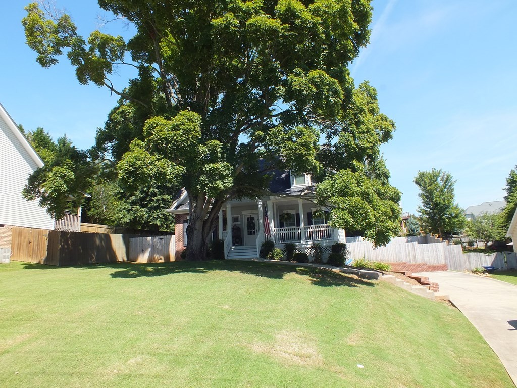 5641 Tucker Road Ooltewah, TN 37363 - Photo 2 of 53 a front view of a house with a yard