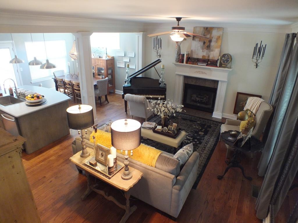 5641 Tucker Road Ooltewah, TN 37363 - Photo 21 of 53 a living room with furniture and a fireplace