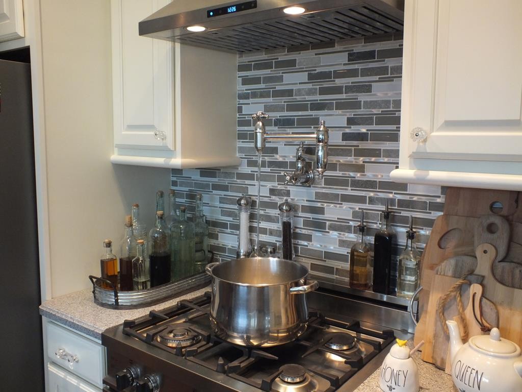 5641 Tucker Road Ooltewah, TN 37363 - Photo 24 of 53 a stove top oven sitting inside of a kitchen