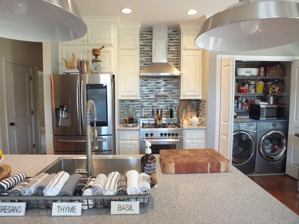5641 Tucker Road Ooltewah, TN 37363 - Photo 25 of 53 a living room with stainless steel appliances kitchen island granite countertop furniture and a view of kitchen