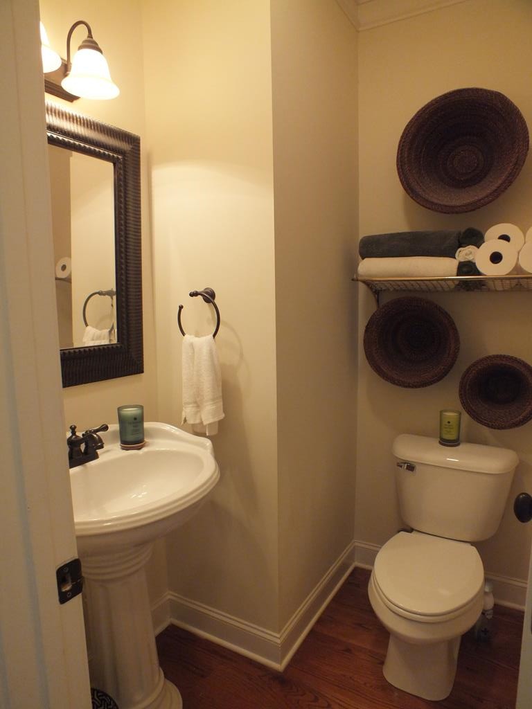 5641 Tucker Road Ooltewah, TN 37363 - Photo 32 of 53 a bathroom with a toilet a sink and a mirror