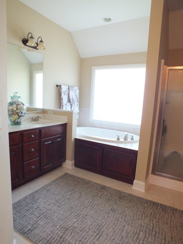 5641 Tucker Road Ooltewah, TN 37363 - Photo 33 of 53 a room with a dresser and a mirror