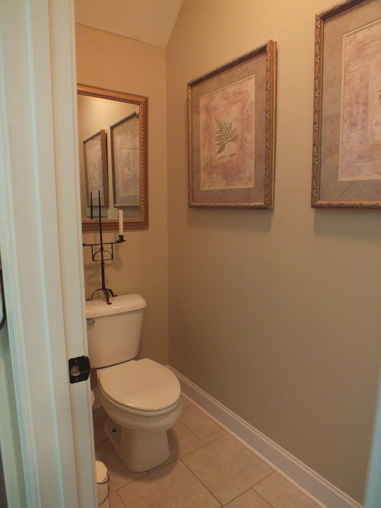 5641 Tucker Road Ooltewah, TN 37363 - Photo 34 of 53 a white toilet sitting next to a small bathroom
