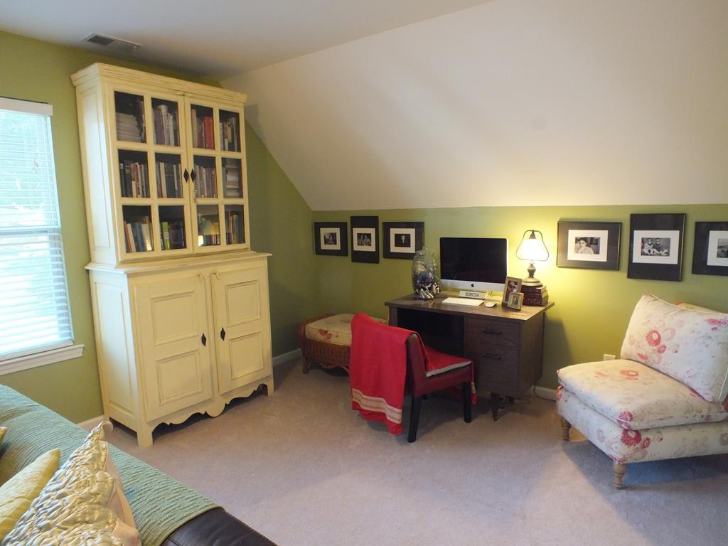 5641 Tucker Road Ooltewah, TN 37363 - Photo 45 of 53 a living room with furniture and a flat screen tv