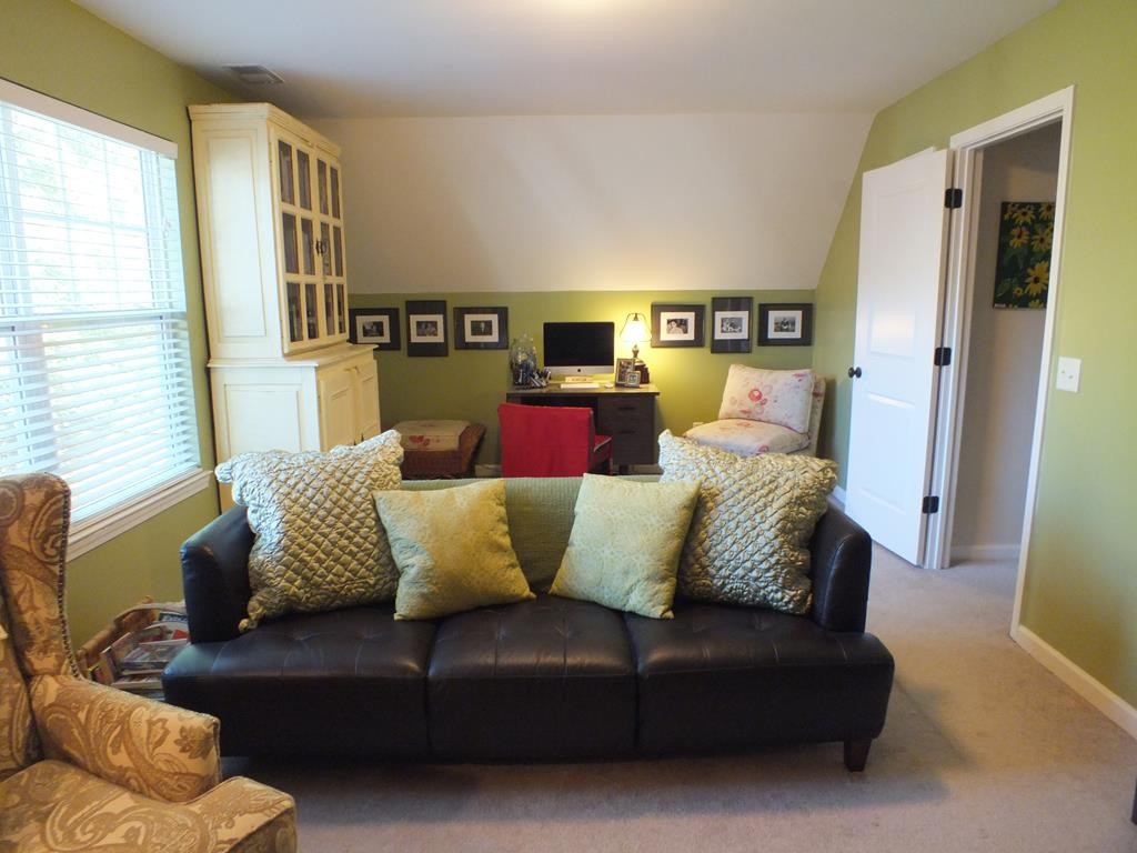 5641 Tucker Road Ooltewah, TN 37363 - Photo 50 of 53 a living room with a couch and a window