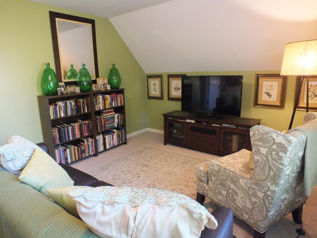 5641 Tucker Road Ooltewah, TN 37363 - Photo 51 of 53 a living room with furniture and a flat screen tv