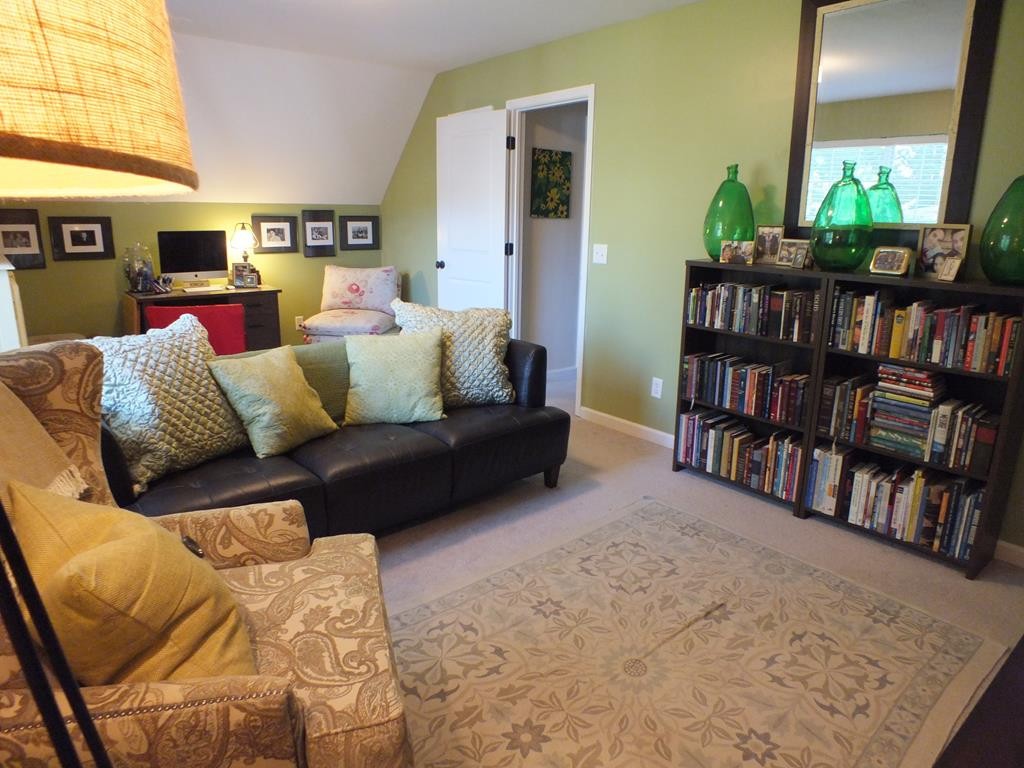 5641 Tucker Road Ooltewah, TN 37363 - Photo 52 of 53 a living room with furniture and a book shelf