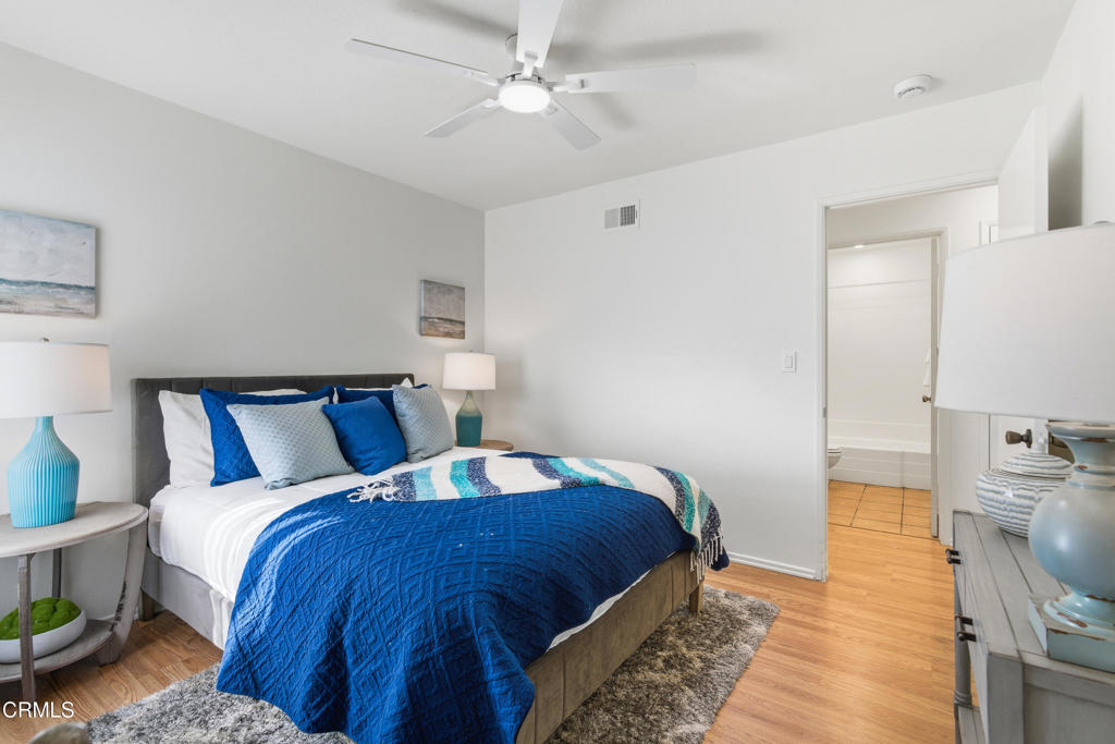 13151 Rose Street Cerritos, CA 90703 - Photo 12 of 24 a bedroom with bed and wooden floor