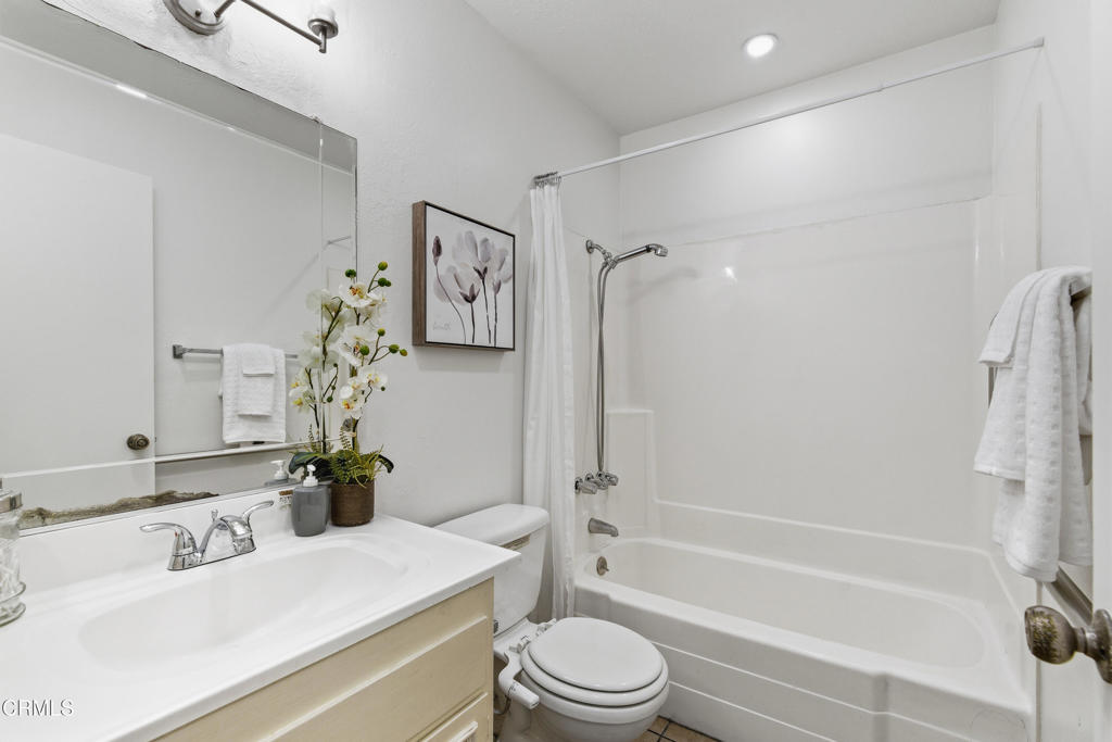 13151 Rose Street Cerritos, CA 90703 - Photo 14 of 24 a bathroom with a sink toilet and shower