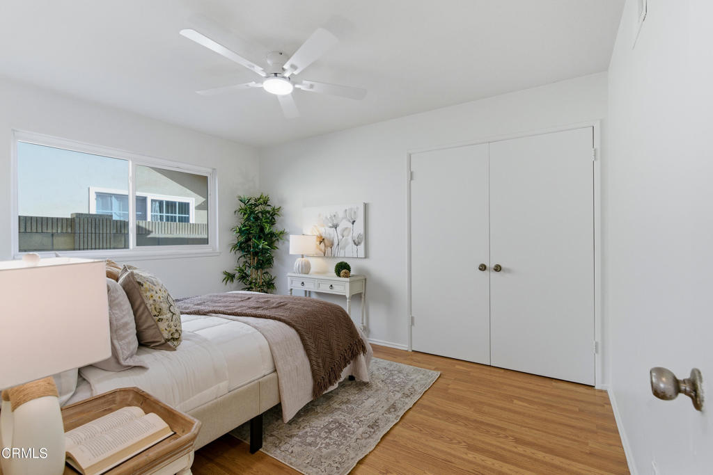 13151 Rose Street Cerritos, CA 90703 - Photo 16 of 24 a bedroom with a bed and a potted plant