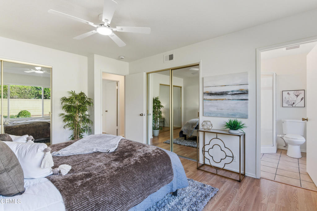 13151 Rose Street Cerritos, CA 90703 - Photo 17 of 24 a bedroom with a bed and a chandelier