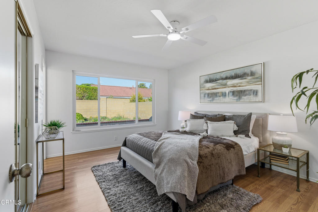 13151 Rose Street Cerritos, CA 90703 - Photo 18 of 24 a spacious bedroom with a bed a dresser with wooden floor