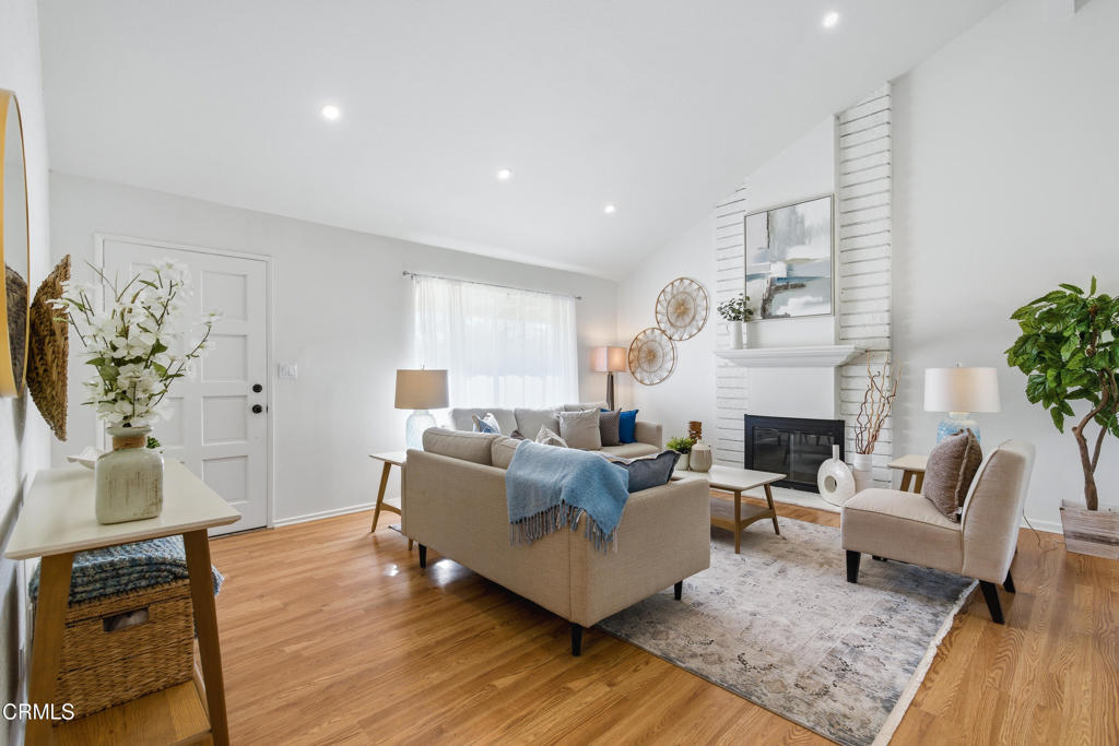 13151 Rose Street Cerritos, CA 90703 - Photo 3 of 24 a living room with furniture and a fireplace