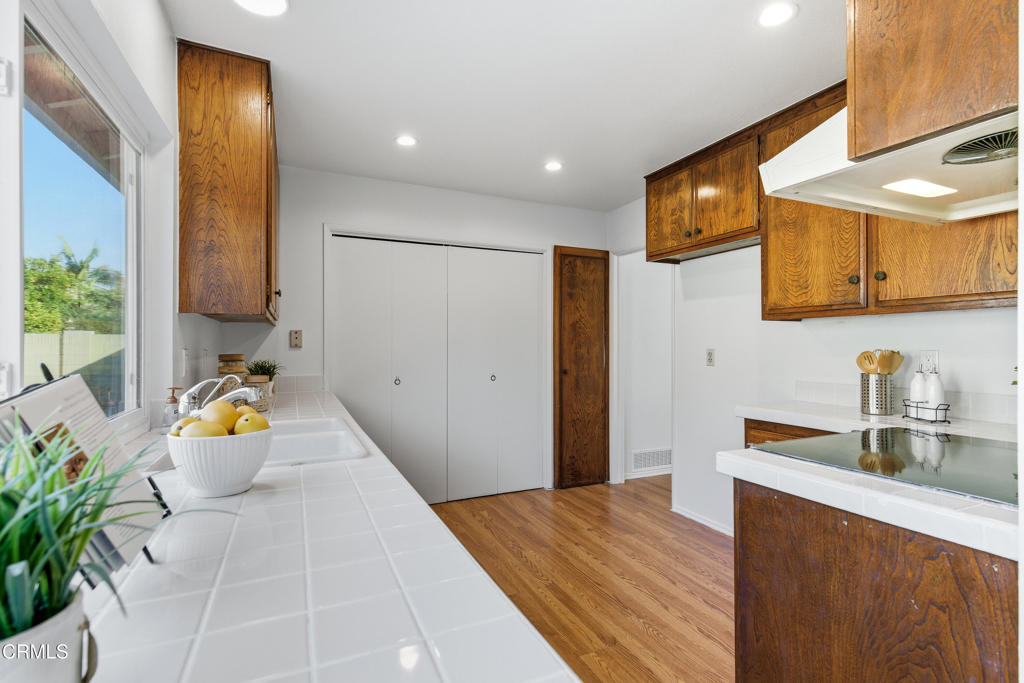 13151 Rose Street Cerritos, CA 90703 - Photo 9 of 24 a kitchen with a refrigerator and a sink