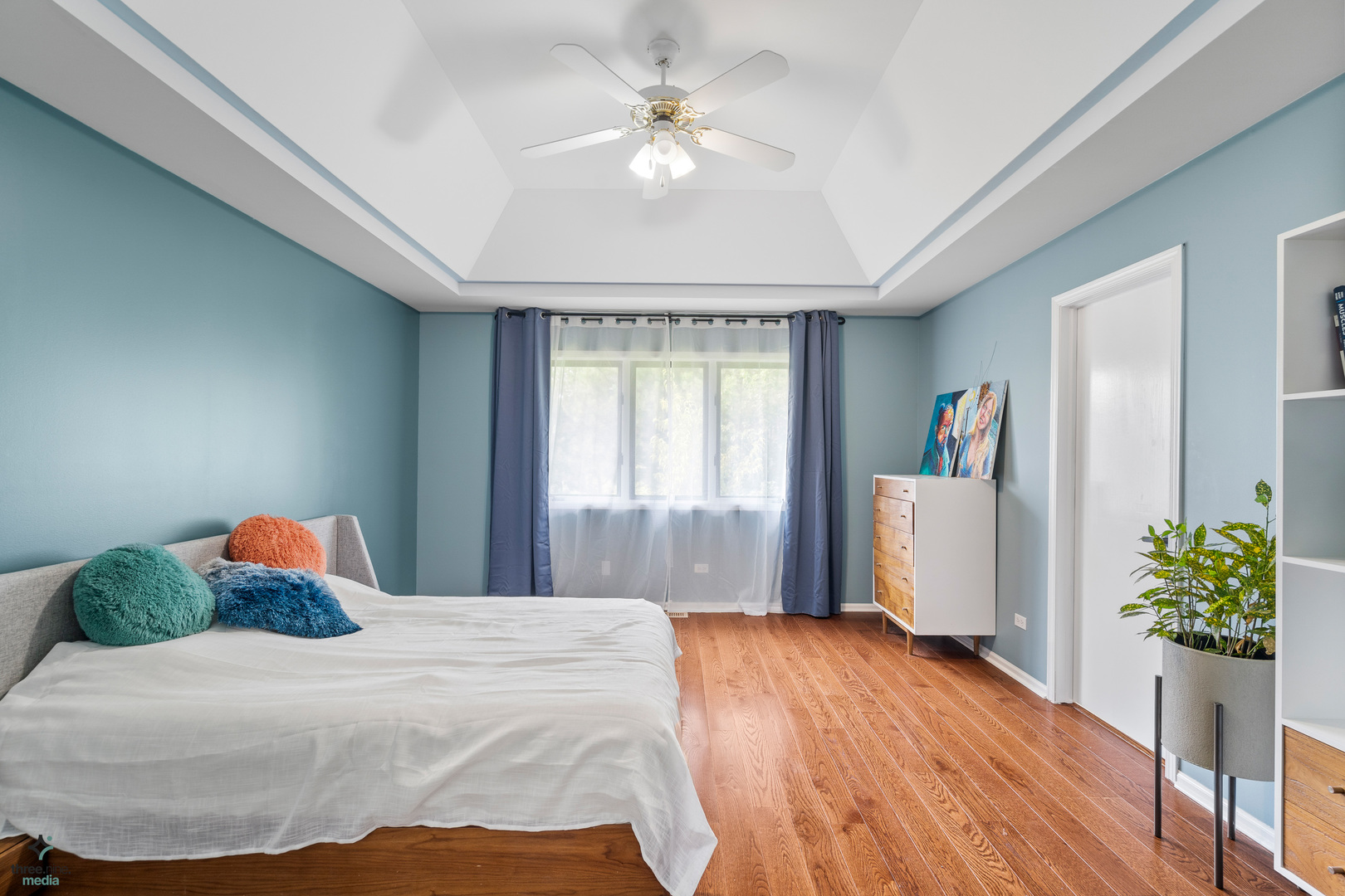 1224 Arbor Drive Lemont, IL 60439 - Photo 13 of 27 a bedroom with a large bed and a chandelier